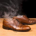 Why do friends disappear after divorce? Image shows a pair of empty shoes smoking like a friend has disappeared in a puff of smoke.